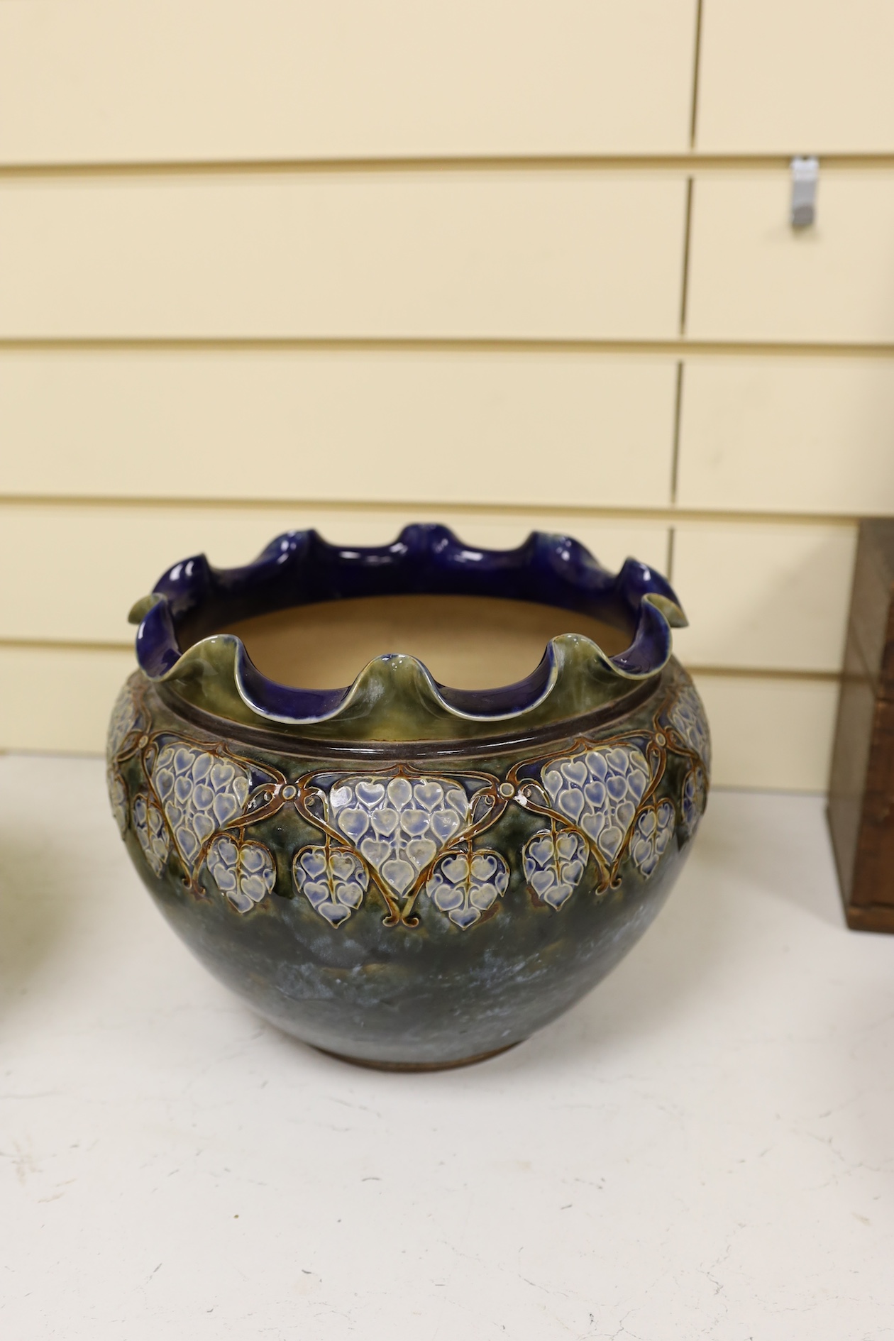 Two Royal Doulton early 20th century stoneware jardinieres and a similar stoneware bowl, tallest jardiniere 22cm high. Condition - frilled edge jardiniere chipped